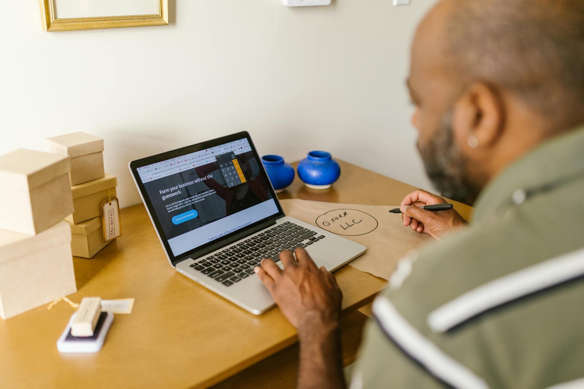 Small business owner reviewing AI marketing automation costs on a laptop