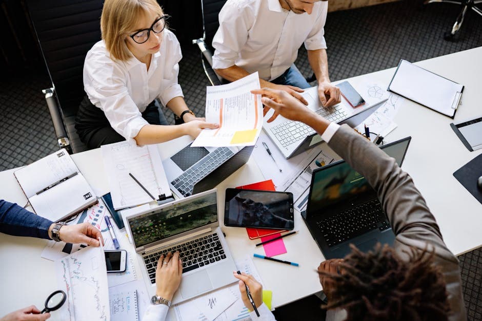 Team reviewing automated workflow steps at a desk